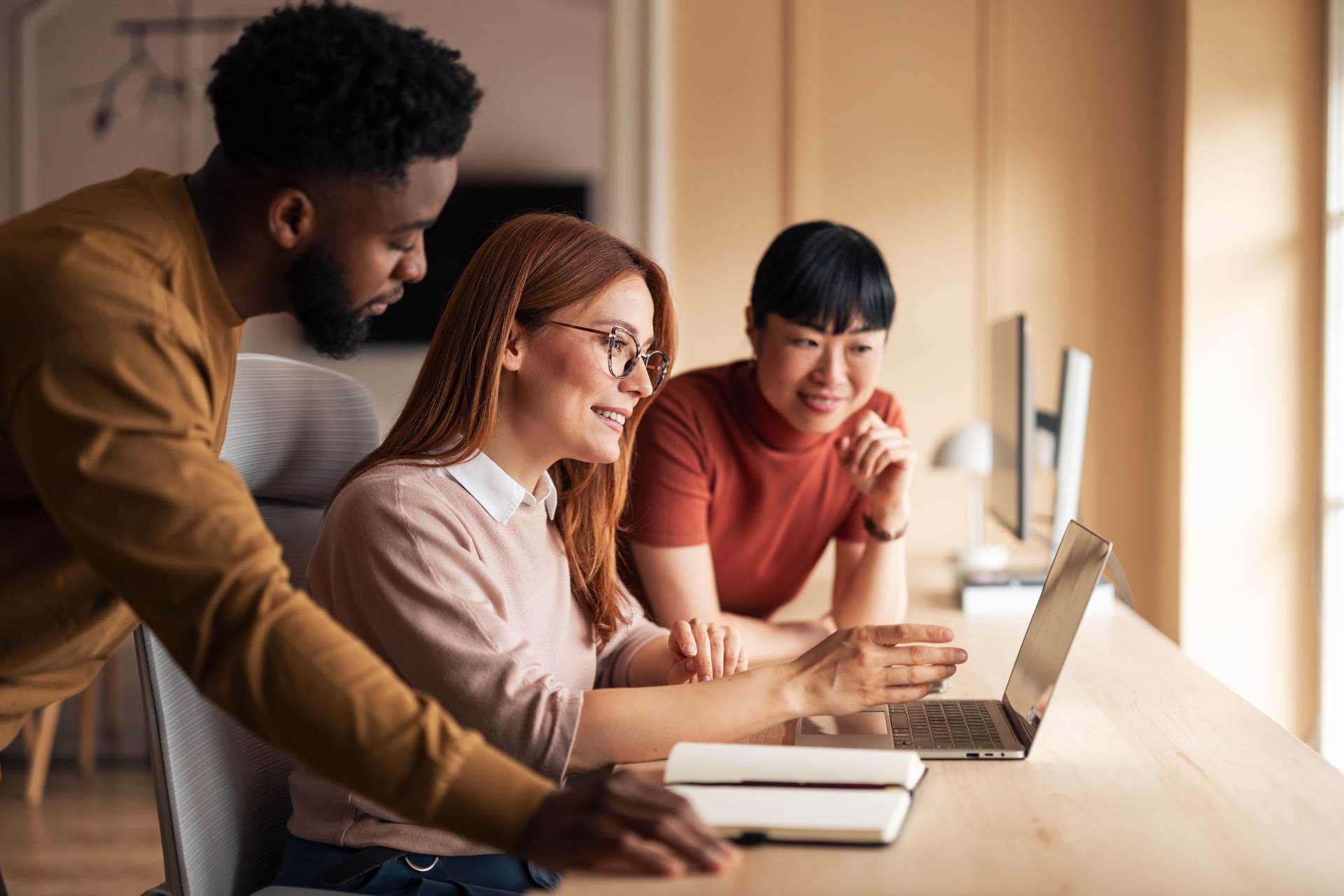 Team Collaborating on a Project in Modern Office Environment
