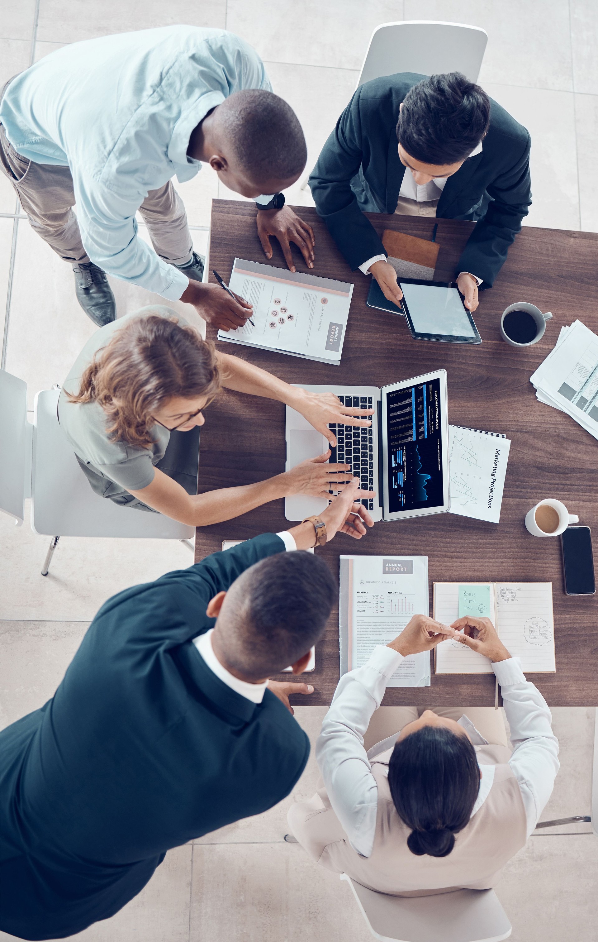 Planning, project management and marketing with business people in meeting for research, strategy and goals with laptop. Growth, analytics and collaboration with employees in corporate office